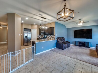 Kitchen with dark brown cabinets, appliances with 