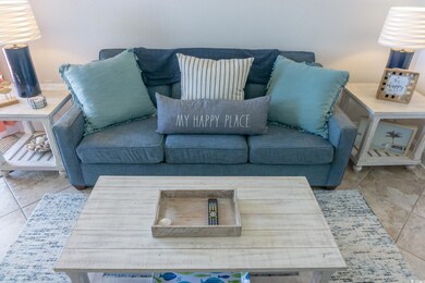 Living room featuring tile patterned floors
