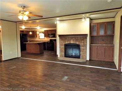 Spacious living room with fireplace and built ins.