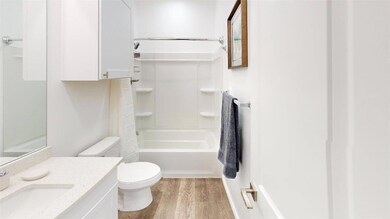 Full bathroom with vanity, toilet,  shower combina