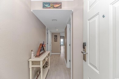 Corridor featuring light wood-type flooring