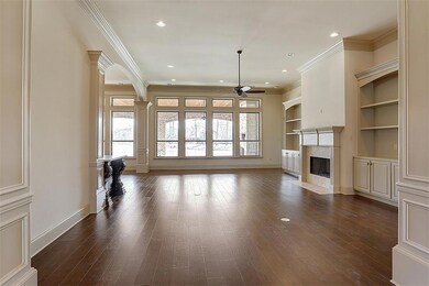 Formal living room features a gas fireplace, wall