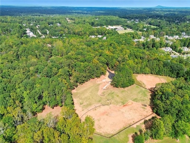 View of property location with a forest