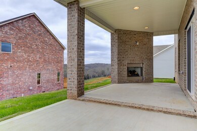 Covered patio with fireplace