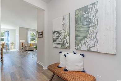 Corridor featuring wood finished floors and baseboards