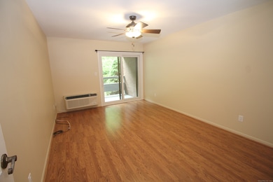 BEDROOM WITH SLIDERS TO BALCONY