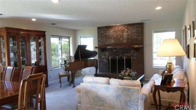 Floor to Ceiling Brick Fireplace with Brick hearth