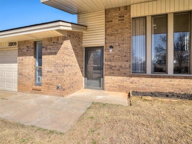 Entrance to property featuring brick siding