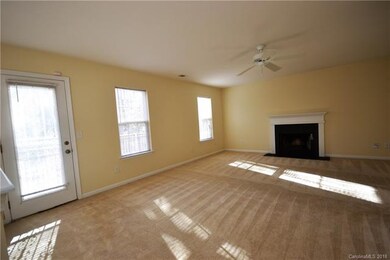 Spacious family room with wood burning fireplace.