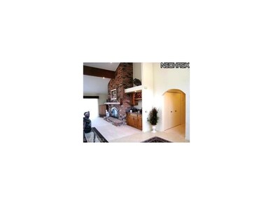 TWO STORY FOYER OVERLOOKS THE LIVING ROOM/DINING R