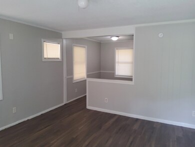 Unfurnished room featuring a healthy amount of sun