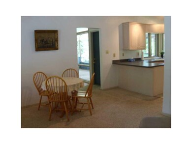 Dining Area. with Kitchen Breakfast Bar and entry 