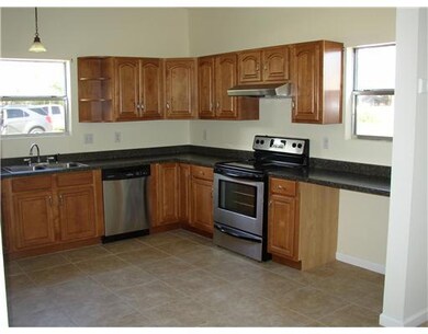 Kitchen. STAINLESS AND BLACK RANGE OVEN AND DISHWA