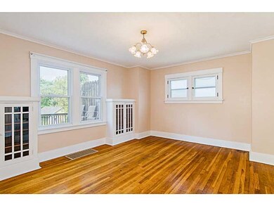 Dining Room. Hardwood flooring and built in cabine