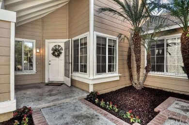 Spacious front courtyard with white picket fence