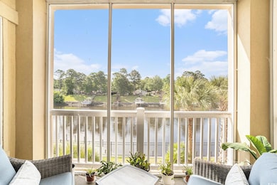 Sunroom with a water view