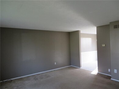 Your View of the Living Room As You Enter the Home