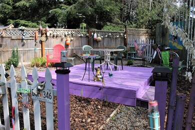 Deck out front behind fence