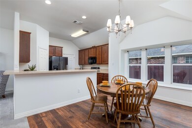 Nook open to the Kitchen with great bar with lots 