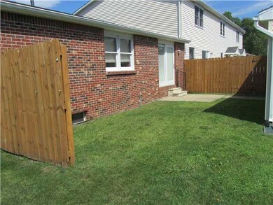 Exterior Back. CONCRETE PATIO OUTSIDE OF KITCHEN..