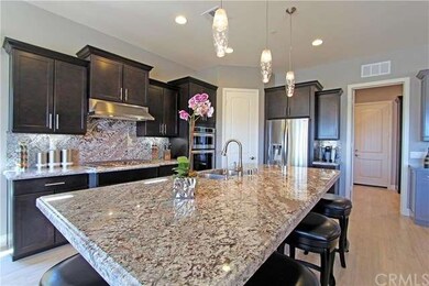 Kitchen with stainless steel appliances and corner