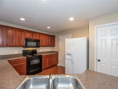 The door on the left of the refrigerator goes to t