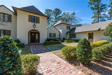 Meticulous sweeping grounds and brick walkway to t
