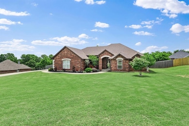 View of front of home featuring brick siding and a shingled roof