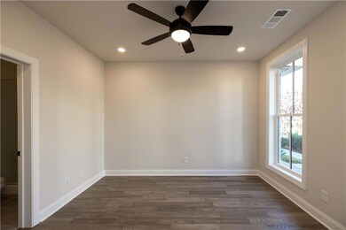 This secondary bedroom features oversized windows,