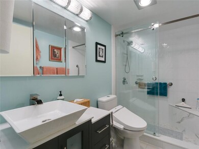 Master Bathroom featuring frameless shower door, s