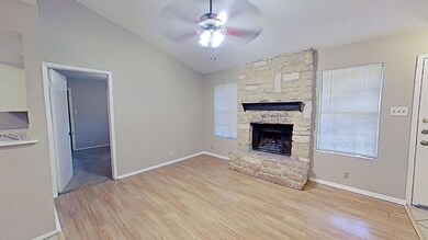 Unfurnished living room featuring a fireplace, ce