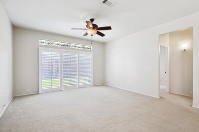 Living Room with entry to Primary Bedroom