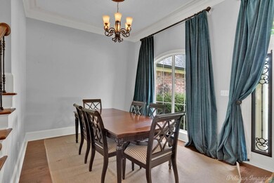 Dining space with ornamental molding, an inviting 