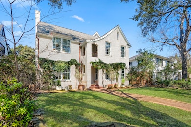 The lush landscape and brick-paved path create a p