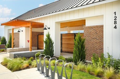 Entrance to property with a standing seam roof, b