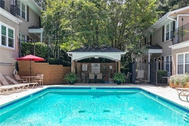 Community pool with a gazebo and a patio