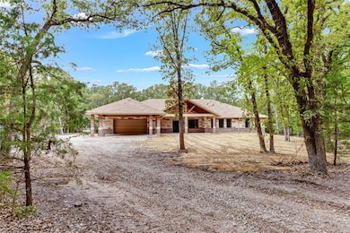 Large carport with roll up door.