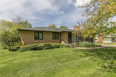 This handsome mid-century modern home sits on almost an acre of land in a serene neighborhood.