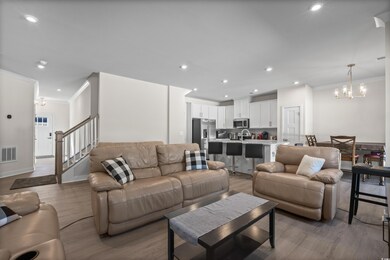 Living room with hardwood / wood-style floors, sin