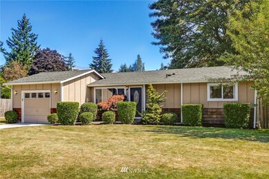 Fresh, crisp landscaping is move-in ready complete with an apple tree (far right).