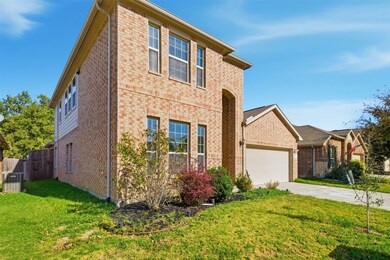 View of front of house featuring brick siding and concrete driveway