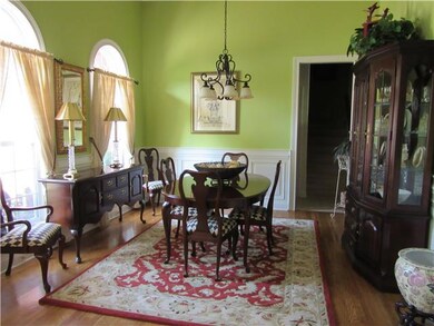 Light filled formal dining room with soaring ceiling!