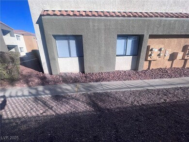 View of property exterior with a tiled roof and st