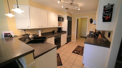 Kitchen has an eclectic flair with updated, contem