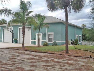 2,400 sq ft garage and guest house. 12 foot overhead doors. Room