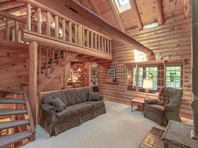 Peace & quiet inside and out of this log cabin hom