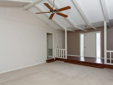 The dramatic vaulted ceiling adds so much character to this room!