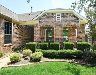 Close up of entrance with low maintenance shrubs a
