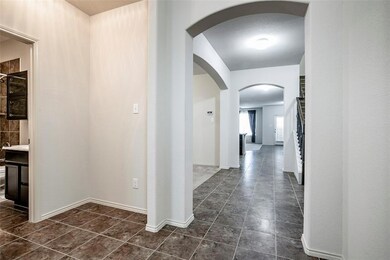 Tall ceilings and arched entry