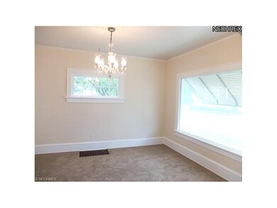 Formal dining room with new carpet.